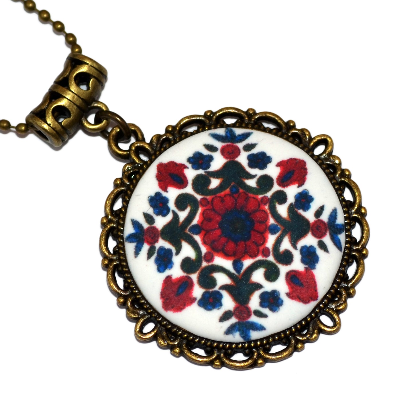 Μενταγιόν σε βίνταζ μπρονζέ στρογγυλή βάση με folk art μοτίβο